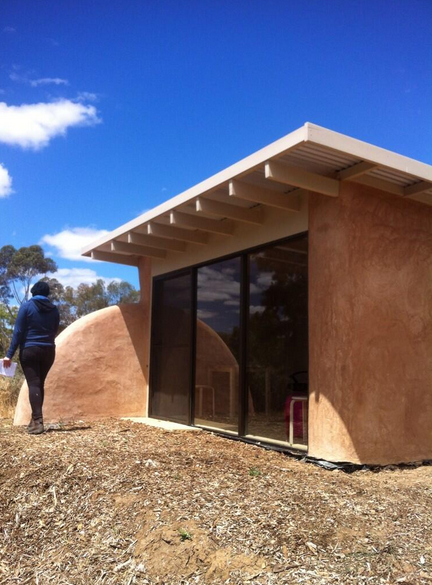The recently-built straw bale studio overlooking pistachios and walnuts at the Food Forest.